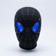 Black webbed mask with glowing blue lenses on a pale studio background